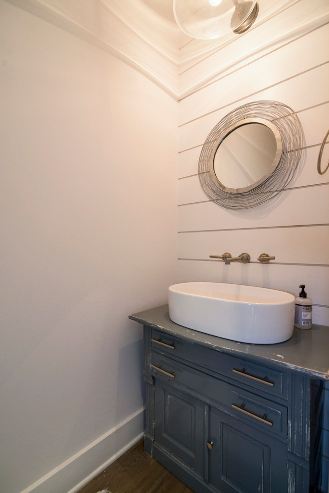 This is an example of a farmhouse cloakroom in Baltimore with freestanding cabinets, white walls, medium hardwood flooring, a vessel sink and distressed cabinets.