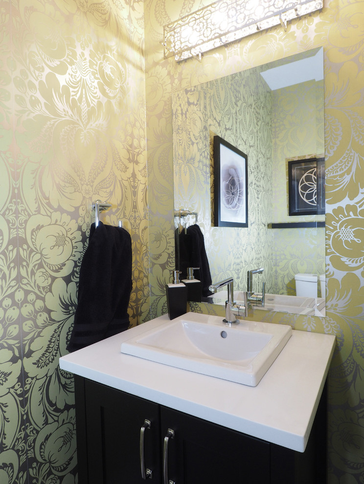 Example of a transitional powder room design in Toronto