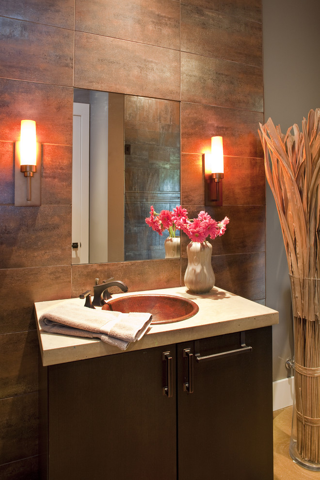 Example of a trendy orange tile powder room design in Austin with a drop-in sink