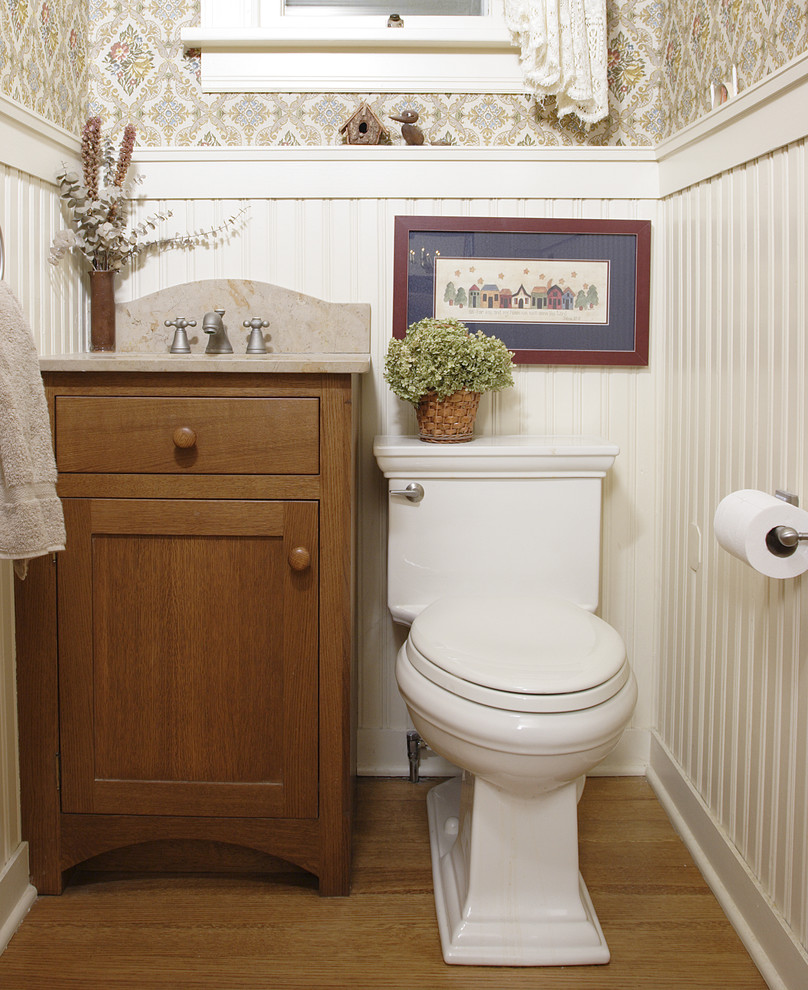 Example of a small classic medium tone wood floor powder room design in Chicago with medium tone wood cabinets, white walls, a one-piece toilet and shaker cabinets
