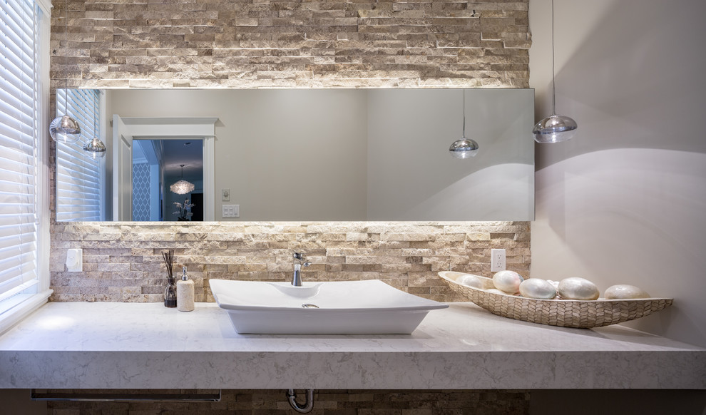 This is an example of a small contemporary cloakroom in Ottawa with beige tiles, beige walls, a vessel sink, engineered stone worktops, a one-piece toilet, travertine tiles, travertine flooring and beige floors.