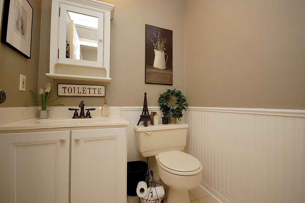 Example of a classic powder room design in Toronto