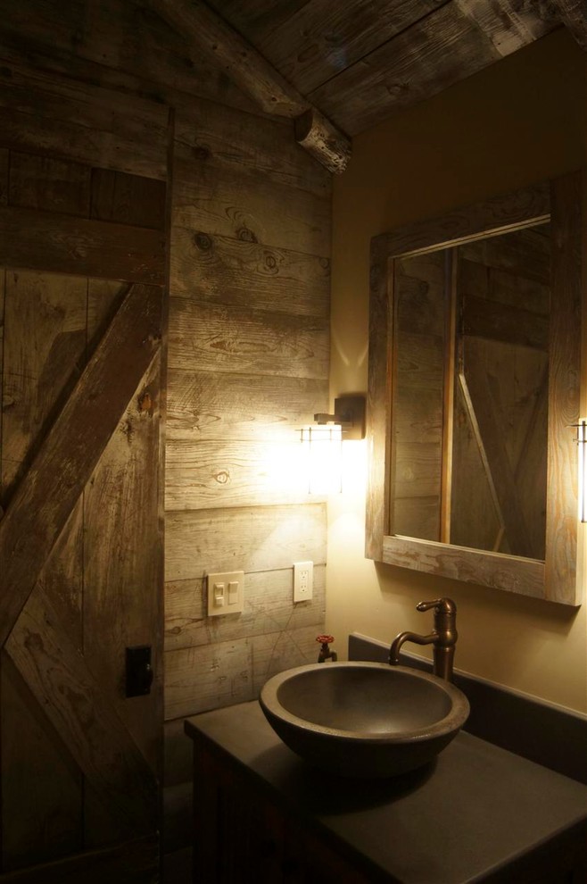 Photo of a small rustic cloakroom in Other with a vessel sink and concrete worktops.
