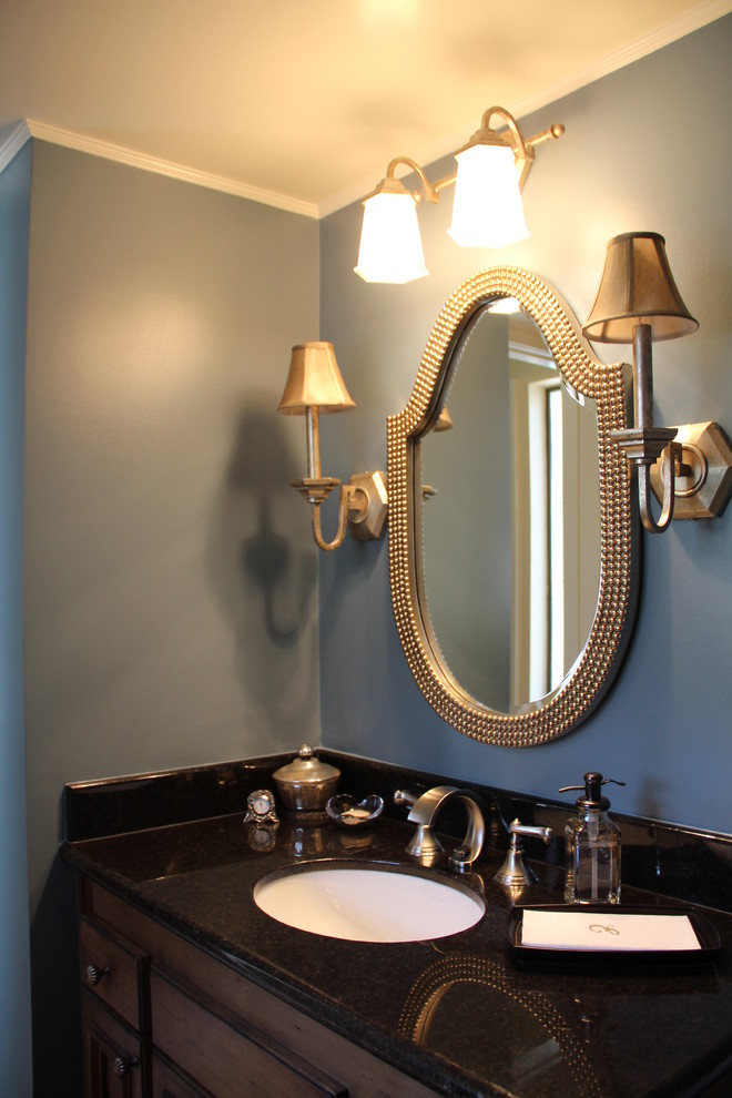 Example of a small classic powder room design in San Francisco with an undermount sink, furniture-like cabinets, dark wood cabinets, granite countertops and blue walls