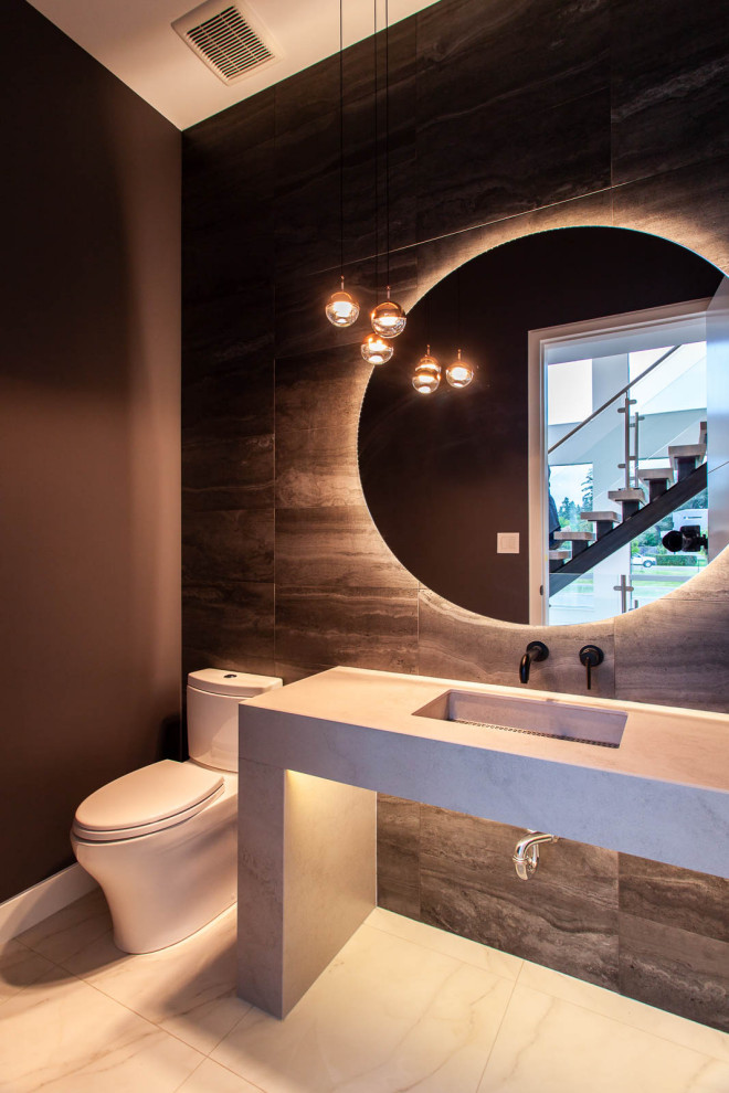 Свежая идея для дизайна: туалет среднего размера в современном стиле с монолитной раковиной и встроенной тумбой - отличное фото интерьера