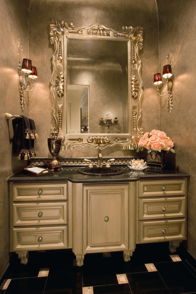 Example of a large classic black tile porcelain tile powder room design in Houston with a drop-in sink, furniture-like cabinets, beige cabinets, granite countertops and gray walls