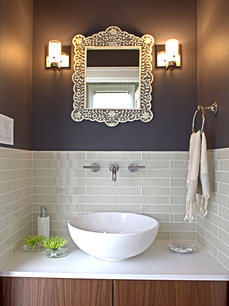 Powder room - small contemporary gray tile and glass tile powder room idea in San Francisco with a vessel sink and quartz countertops