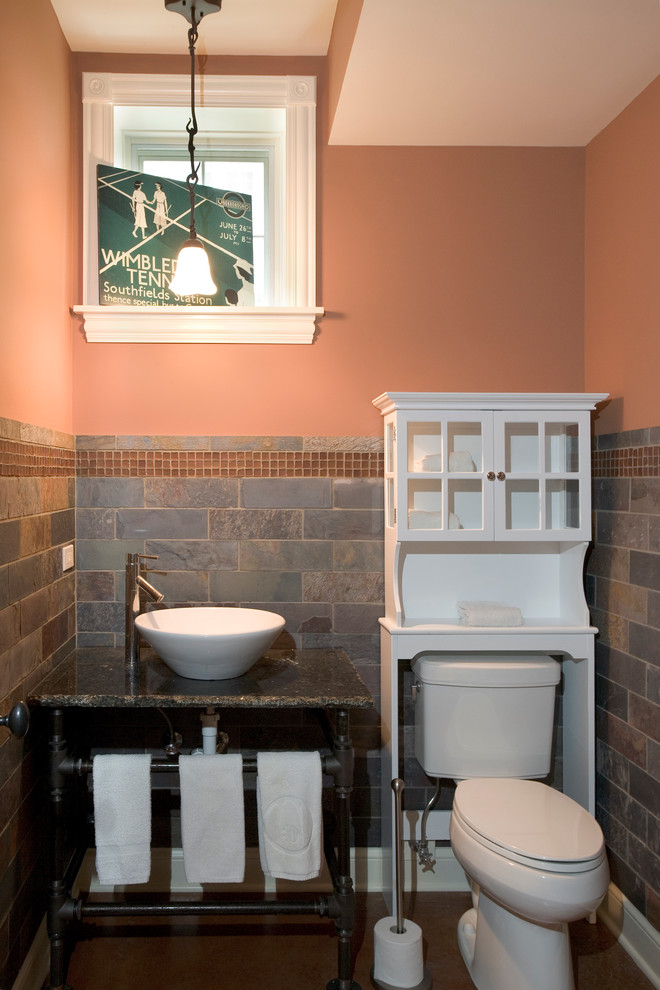Photo of a medium sized classic cloakroom in Chicago with freestanding cabinets, a two-piece toilet, grey tiles, light hardwood flooring, a vessel sink, granite worktops, pink walls, white cabinets and slate tiles.