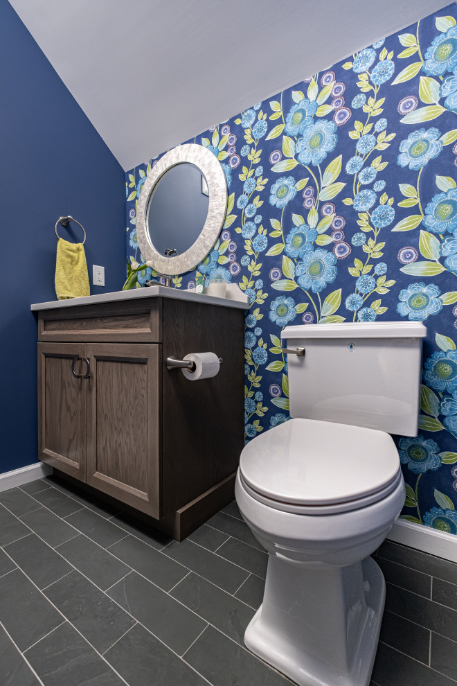Inspiration for a medium sized traditional cloakroom in Newark with shaker cabinets, light wood cabinets, a two-piece toilet, multi-coloured walls, slate flooring, a submerged sink, engineered stone worktops, white worktops, a built in vanity unit and a vaulted ceiling.