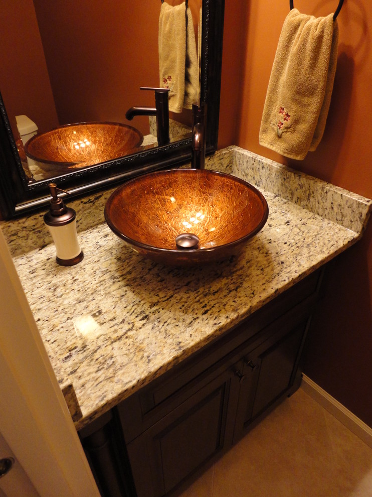 Powder room with golden vessel sink Transitional Powder Room