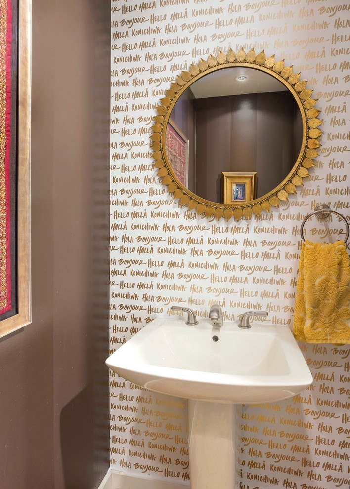 Powder room - small eclectic powder room idea in Los Angeles with brown walls and a pedestal sink