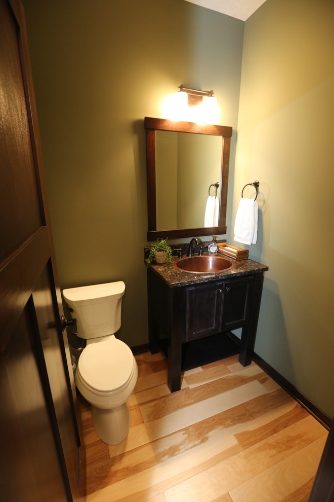 Photo of a traditional cloakroom in Minneapolis with light hardwood flooring and a built-in sink.