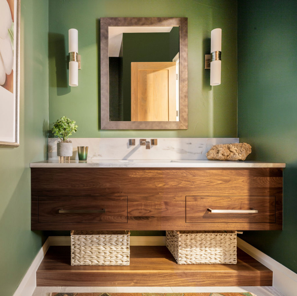 Photo of a medium sized classic cloakroom in Denver with flat-panel cabinets, green walls, porcelain flooring, marble worktops, white worktops, dark wood cabinets, a submerged sink, grey floors and a floating vanity unit.