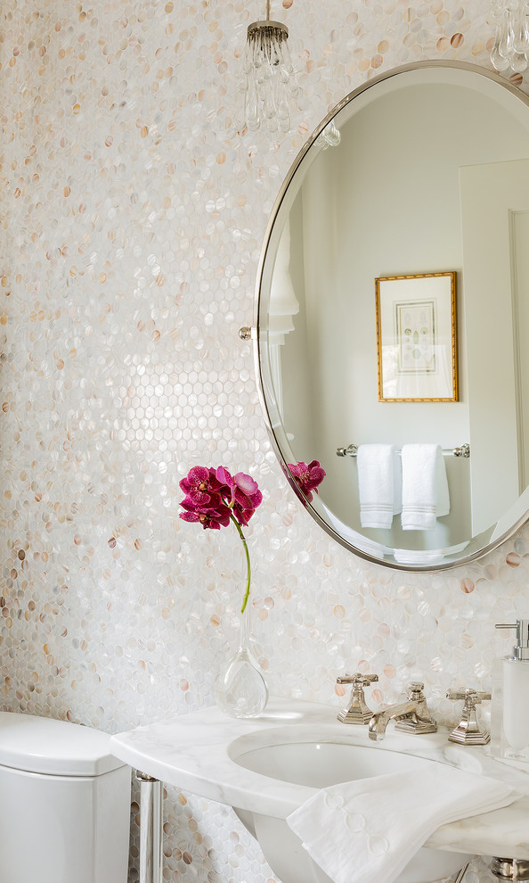 Powder room - small transitional multicolored tile powder room idea in Boston with a pedestal sink and marble countertops