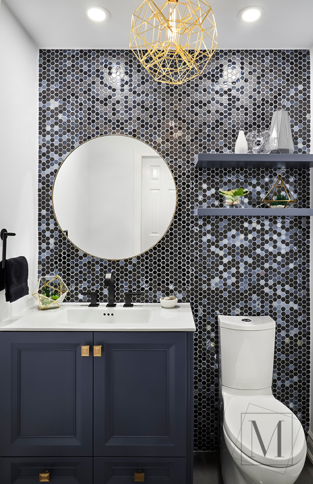 Design ideas for a small contemporary cloakroom in Toronto with recessed-panel cabinets, blue cabinets, multi-coloured tiles, mosaic tiles, white walls, an integrated sink and white worktops.