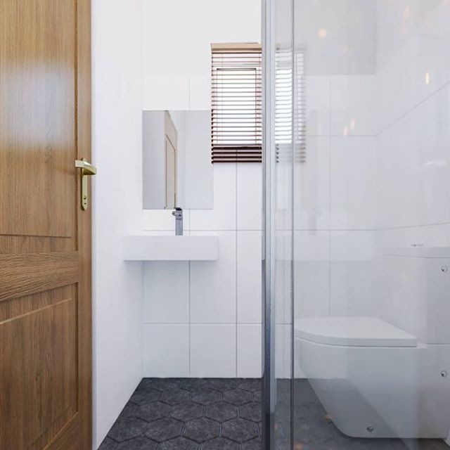 Small contemporary cloakroom in Other with glass-front cabinets, a one-piece toilet, white tiles, marble tiles, white walls, marble flooring, a built-in sink, glass worktops, black floors and white worktops.