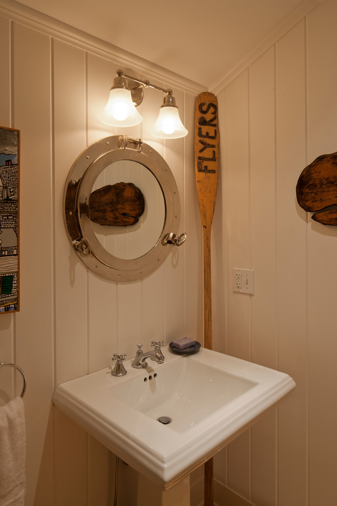 This is an example of a coastal cloakroom in Boston with a pedestal sink and feature lighting.