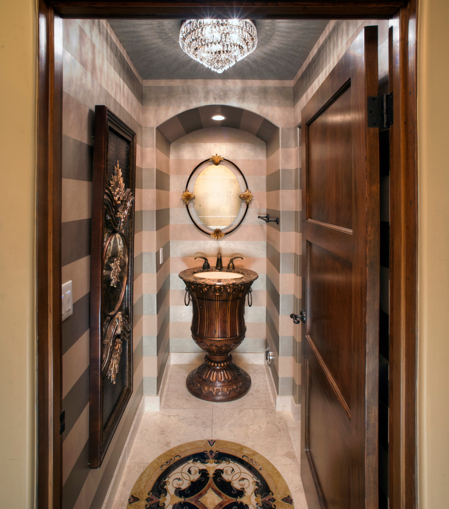 Example of a mid-sized eclectic beige tile marble floor powder room design in Miami with a vessel sink, granite countertops and multicolored walls