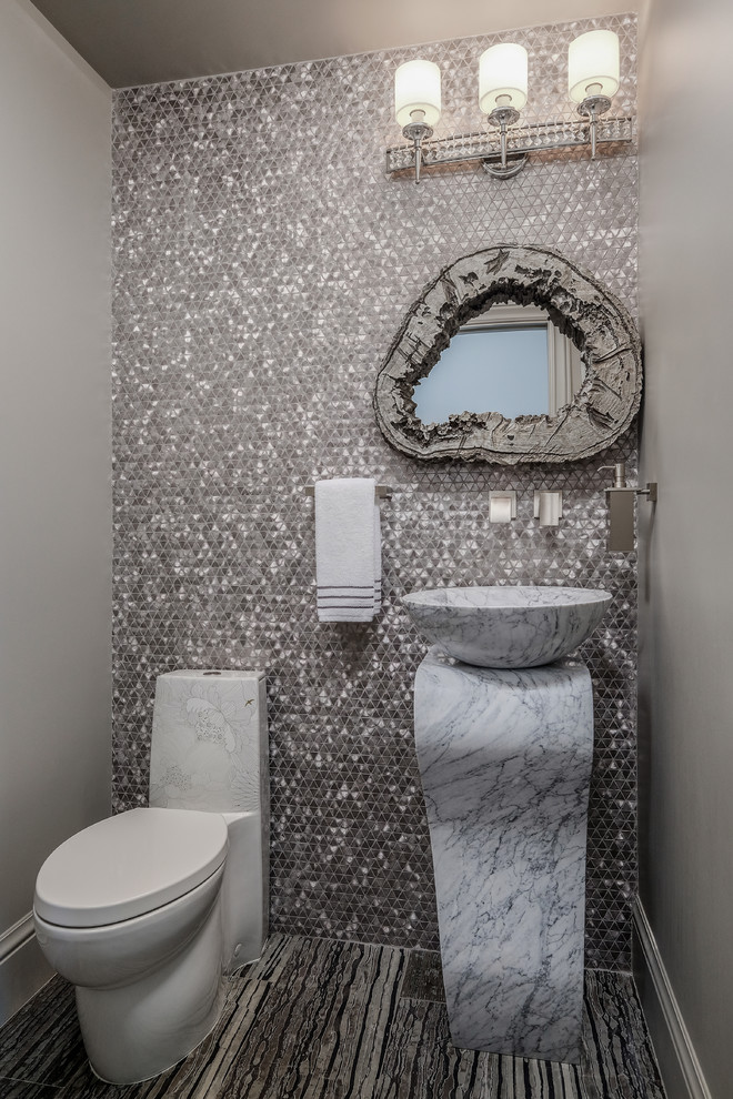 Design ideas for a mediterranean cloakroom in San Francisco with a one-piece toilet, multi-coloured tiles, mosaic tiles, grey walls, a vessel sink, marble worktops, multi-coloured floors and white worktops.