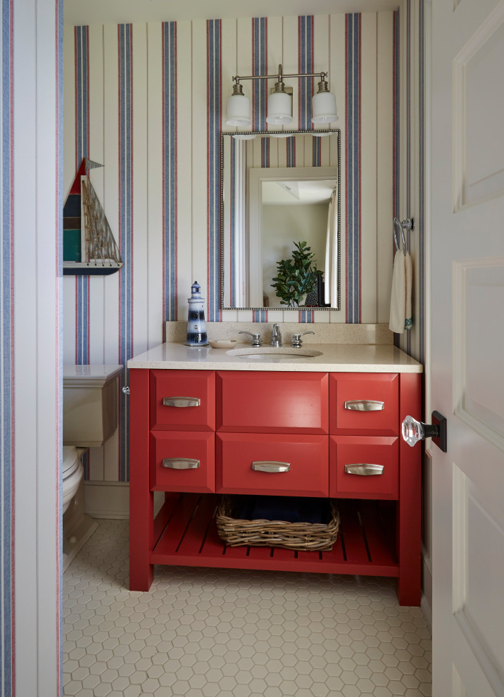 Inspiration for a mid-sized craftsman porcelain tile and white floor powder room remodel in Chicago with raised-panel cabinets, red cabinets, a two-piece toilet, multicolored walls, an undermount sink and granite countertops