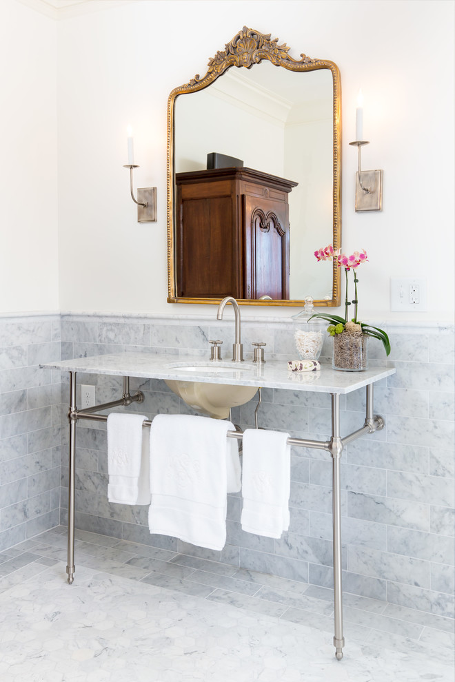 Inspiration for a medium sized farmhouse cloakroom in Birmingham with grey tiles, white walls, a console sink, open cabinets, a two-piece toilet, marble tiles, marble flooring, marble worktops, white floors and white worktops.
