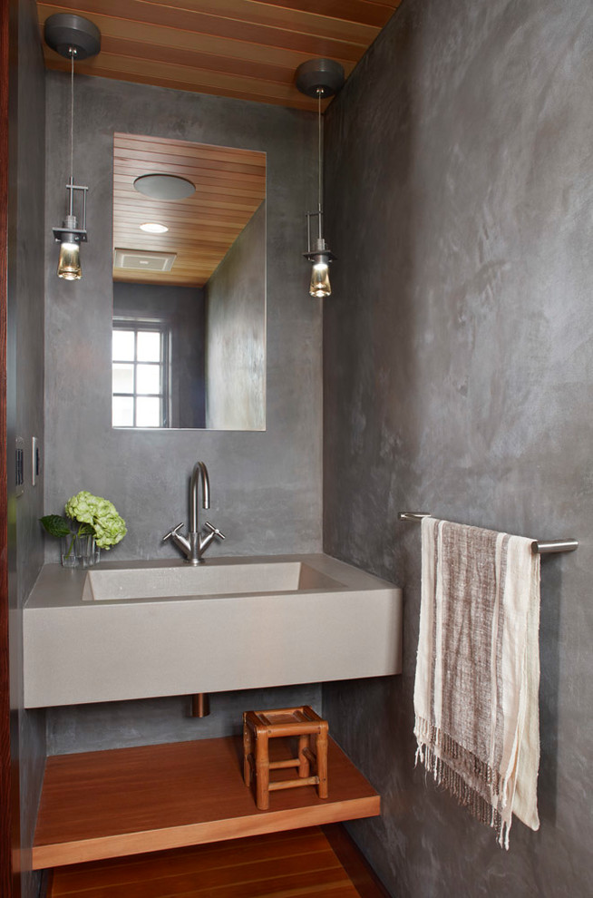 Inspiration for a transitional powder room remodel in San Francisco with open cabinets, medium tone wood cabinets, gray walls and an integrated sink