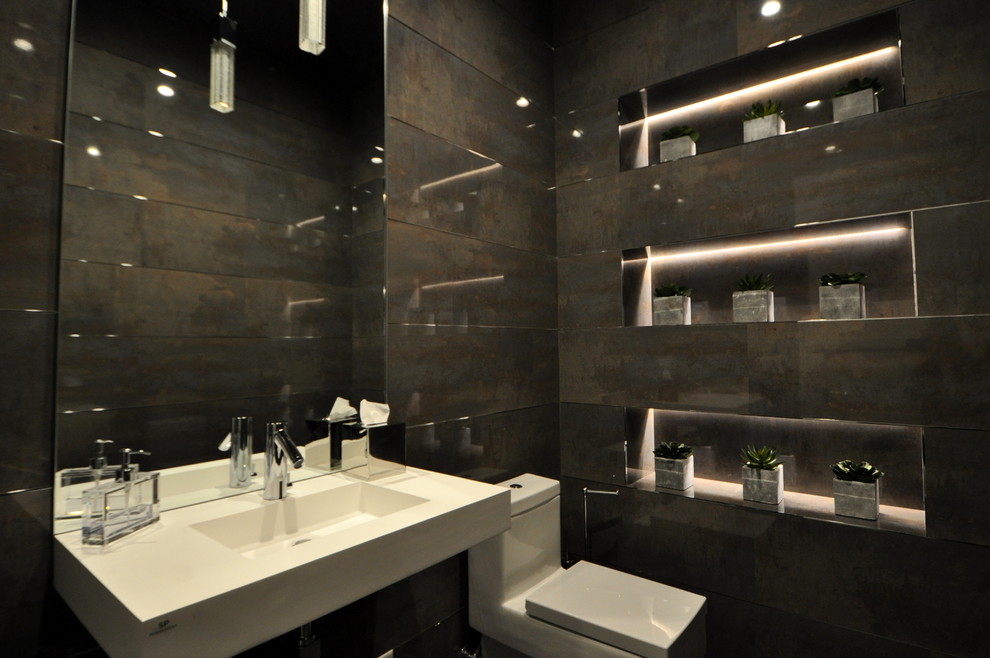 Example of a small minimalist gray tile powder room design in Miami with a one-piece toilet