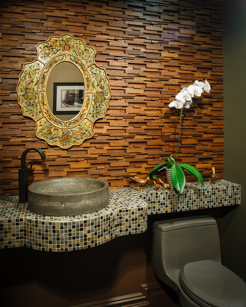 Example of a trendy powder room design in New York with a vessel sink and tile countertops