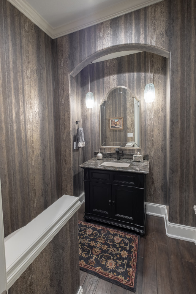 Inspiration for a large classic cloakroom in Detroit with black cabinets, brown walls, dark hardwood flooring, a submerged sink, brown floors, a freestanding vanity unit and wallpapered walls.