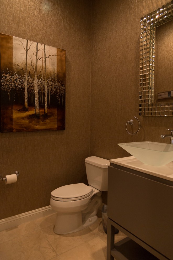 This is an example of a small contemporary cloakroom in Las Vegas with a pedestal sink, flat-panel cabinets, grey cabinets, quartz worktops, a two-piece toilet, beige tiles, brown walls and ceramic flooring.