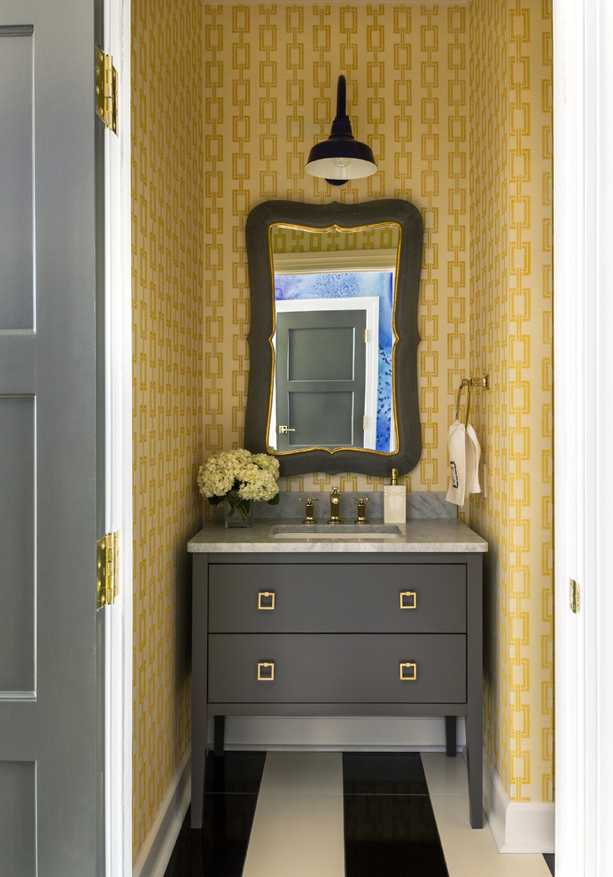 На фото: туалет в стиле неоклассика (современная классика) с врезной раковиной, желтыми стенами, мраморным полом и серой столешницей с