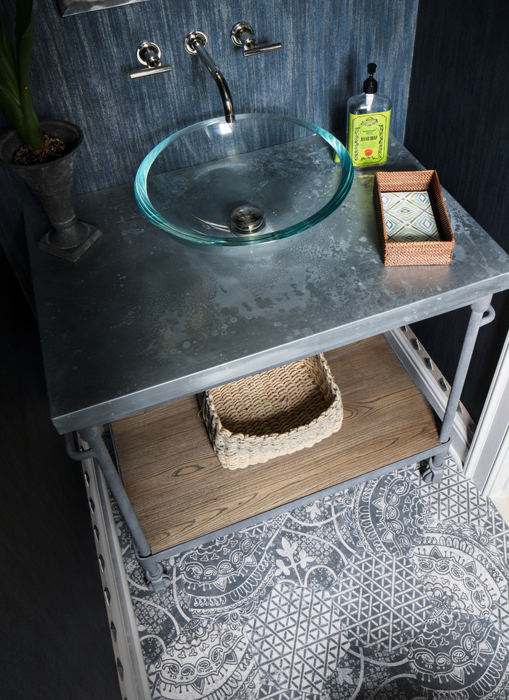 Design ideas for a small beach style cloakroom in New York with a two-piece toilet, black tiles, black walls, porcelain flooring, a vessel sink and black floors.