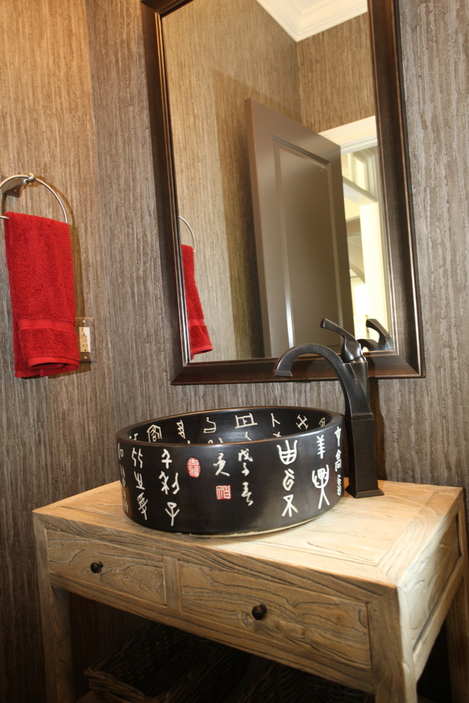 Example of a small transitional powder room design in Atlanta with a drop-in sink