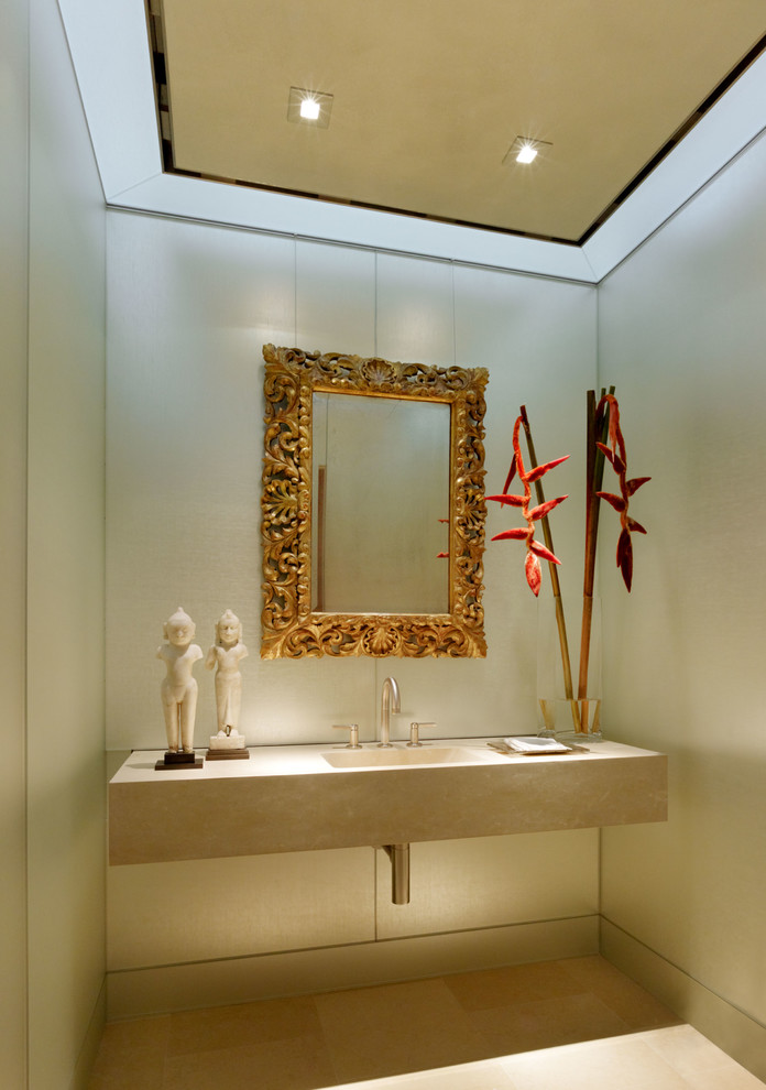 Diseño de aseo actual con paredes grises, lavabo integrado, suelo beige y encimeras beige