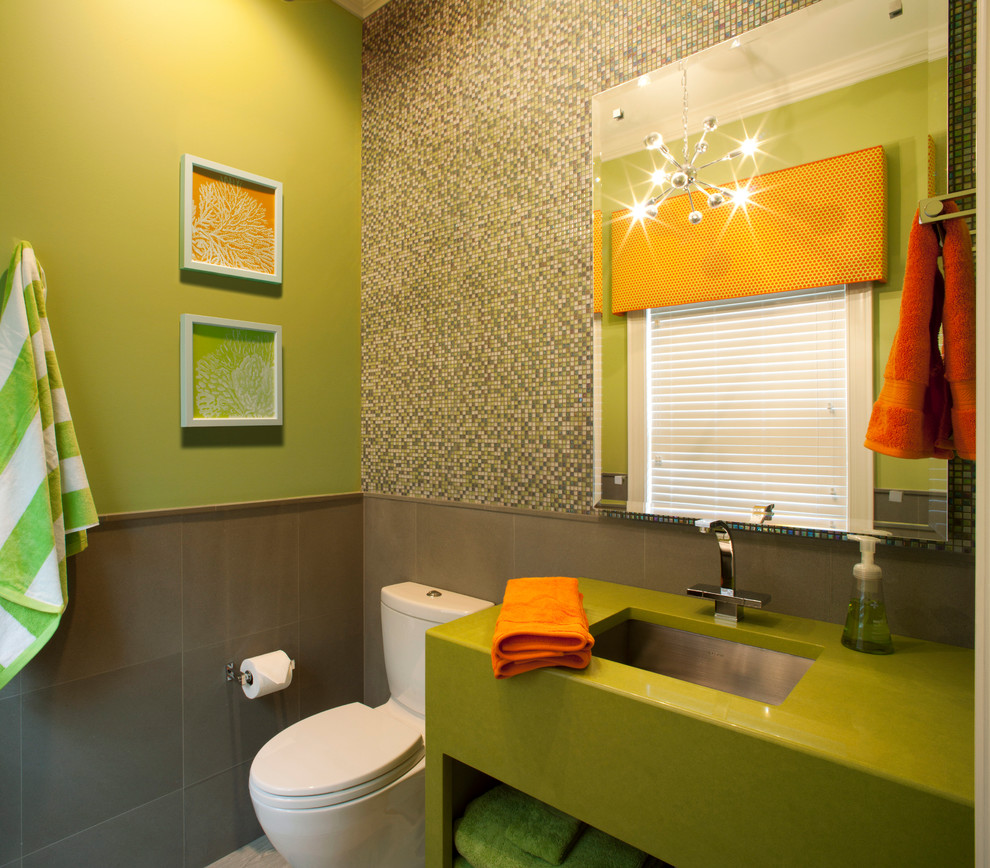 Example of a trendy mosaic tile powder room design in Jacksonville with an undermount sink, open cabinets and a two-piece toilet