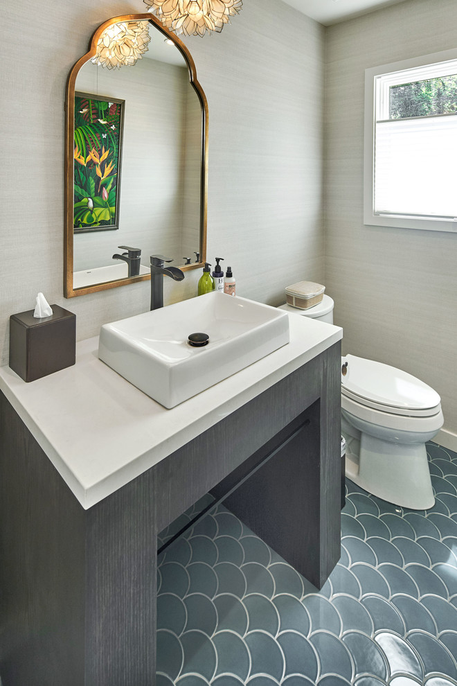 Large transitional ceramic tile and gray floor powder room photo in San Francisco with a two-piece toilet, gray walls, a vessel sink, solid surface countertops and white countertops