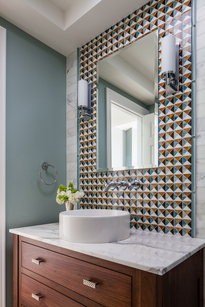 Photo of a traditional cloakroom in San Francisco with a vessel sink, flat-panel cabinets, dark wood cabinets, multi-coloured tiles and blue walls.