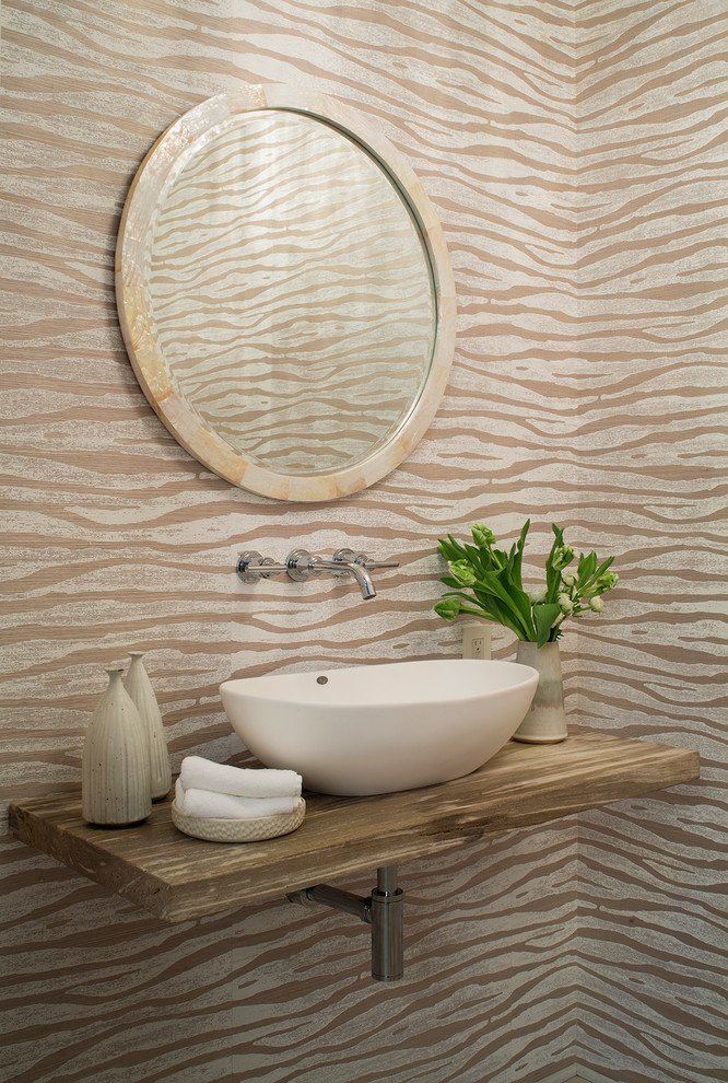 Small transitional powder room photo in Santa Barbara with multicolored walls, a vessel sink, wood countertops and brown countertops