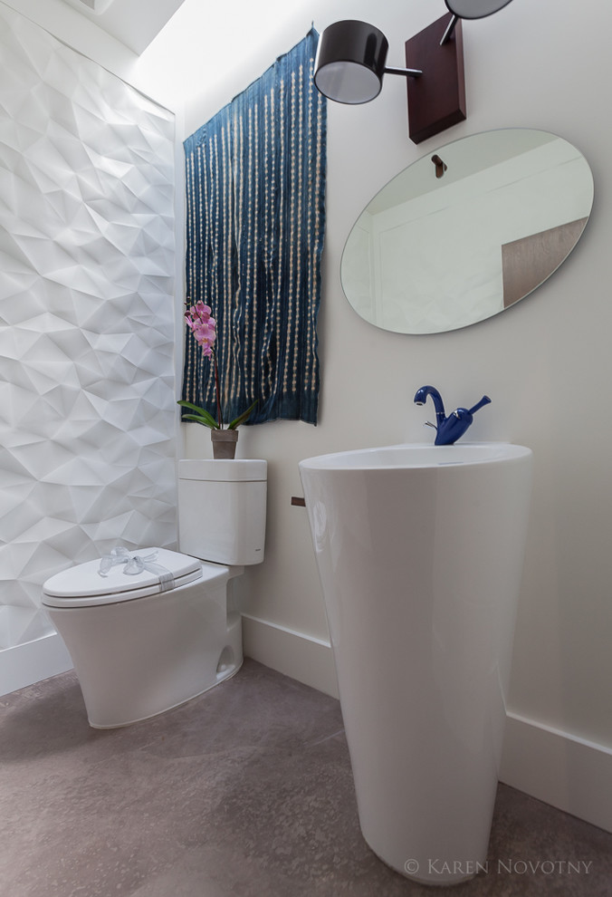 Esempio di un bagno di servizio contemporaneo di medie dimensioni con pareti bianche e lavabo a colonna