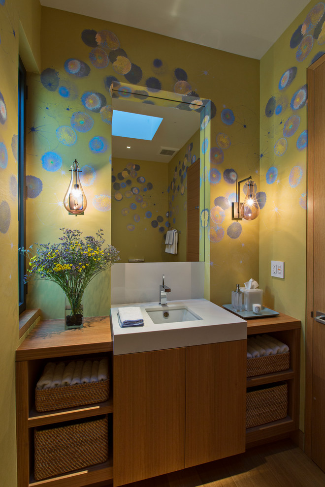 Photo of a small contemporary cloakroom in San Francisco with flat-panel cabinets, medium wood cabinets, green walls, light hardwood flooring, a submerged sink, wooden worktops and brown worktops.