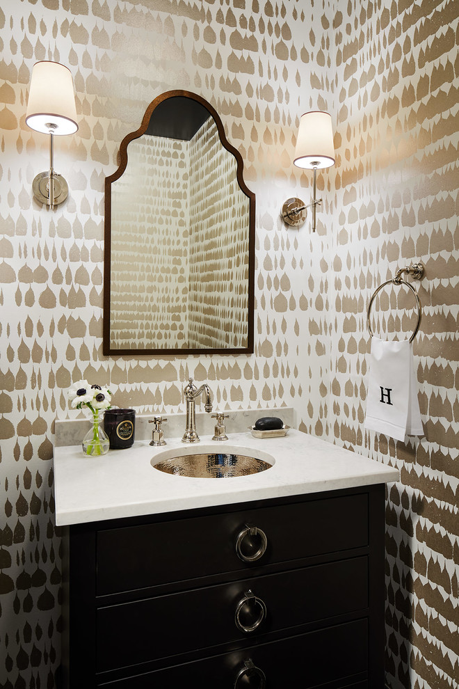 Powder room - mid-sized transitional powder room idea in Chicago with furniture-like cabinets, black cabinets, multicolored walls, an undermount sink, a one-piece toilet, quartz countertops and gray countertops