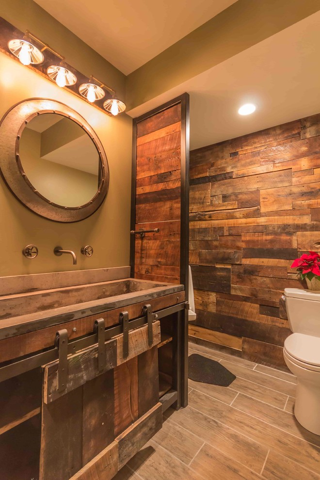 Medium sized rustic cloakroom in Detroit with brown cabinets, a one-piece toilet, brown walls, ceramic flooring, an integrated sink, concrete worktops and grey floors.
