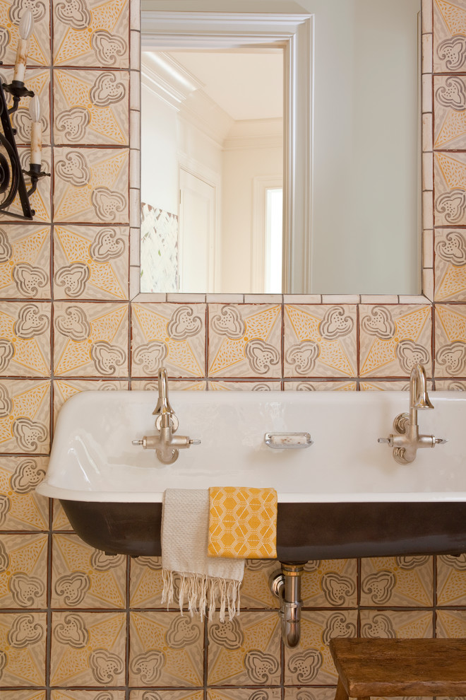 Traditional cloakroom in Other with a trough sink and multi-coloured tiles.