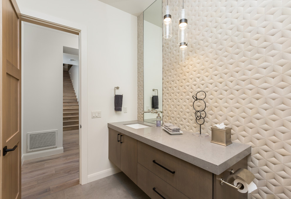Inspiration for a large contemporary concrete floor and gray floor powder room remodel in Phoenix with flat-panel cabinets, brown cabinets, quartz countertops and gray countertops