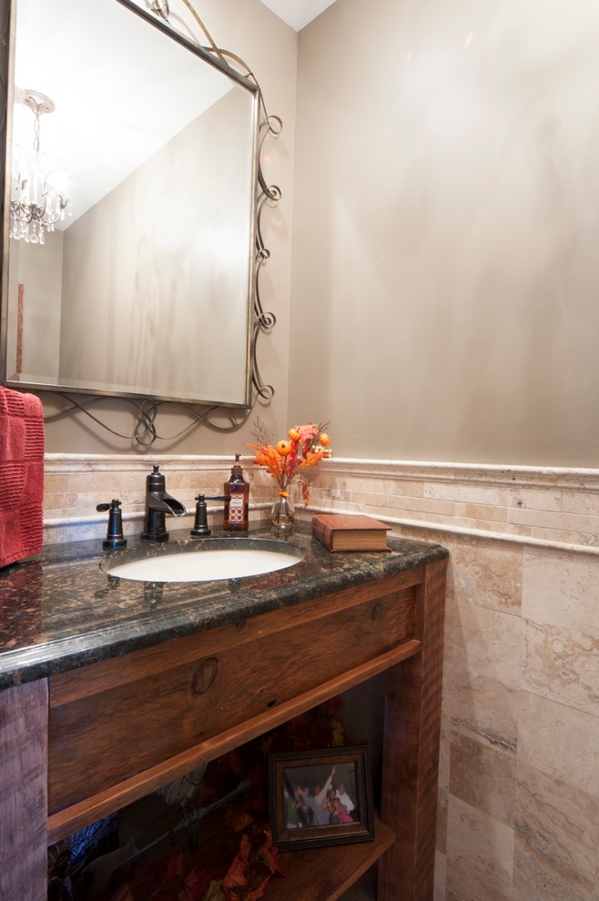 Example of a classic travertine tile powder room design in New York