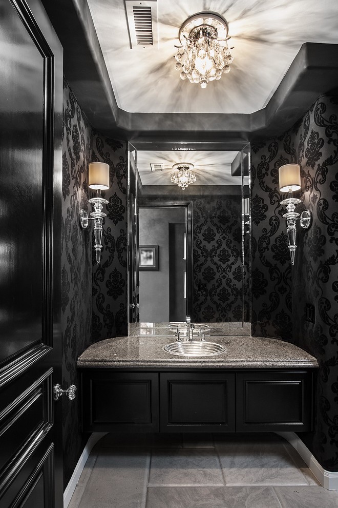 Inspiration for a contemporary powder room remodel in Orange County with a drop-in sink, black cabinets, black walls and gray countertops