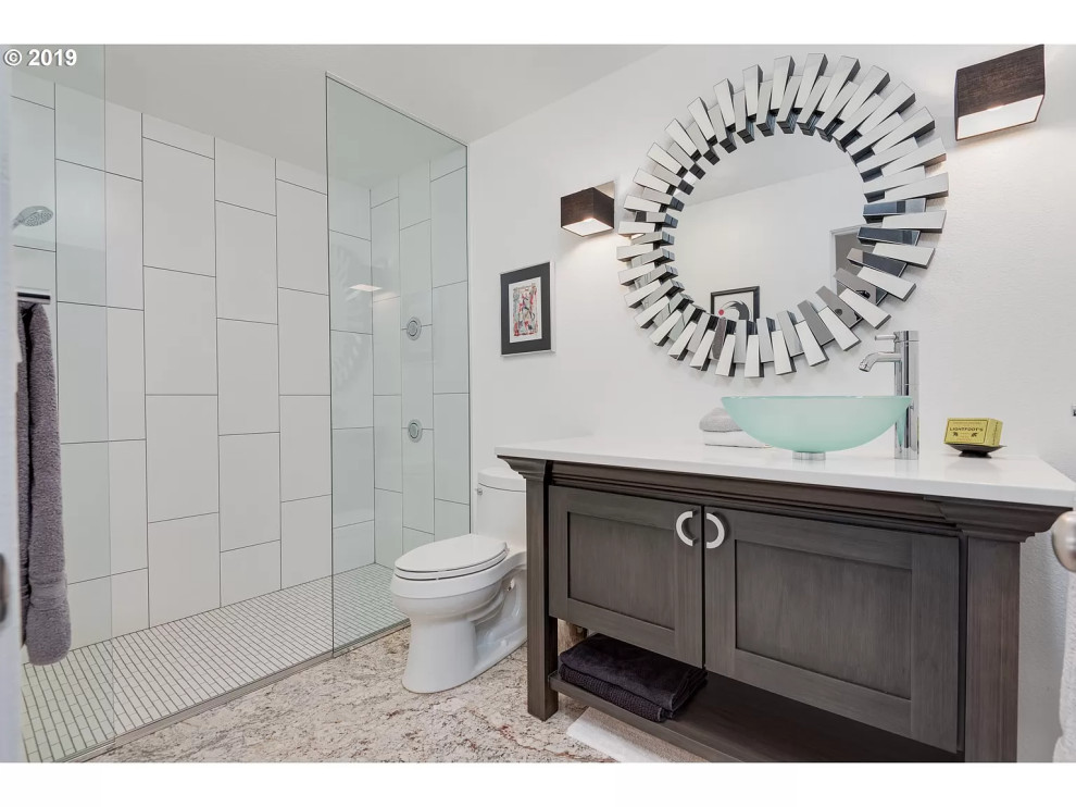 This is an example of a small contemporary cloakroom in Portland with recessed-panel cabinets, dark wood cabinets, a one-piece toilet, white tiles, porcelain tiles, white walls, a vessel sink, engineered stone worktops, white floors and white worktops.