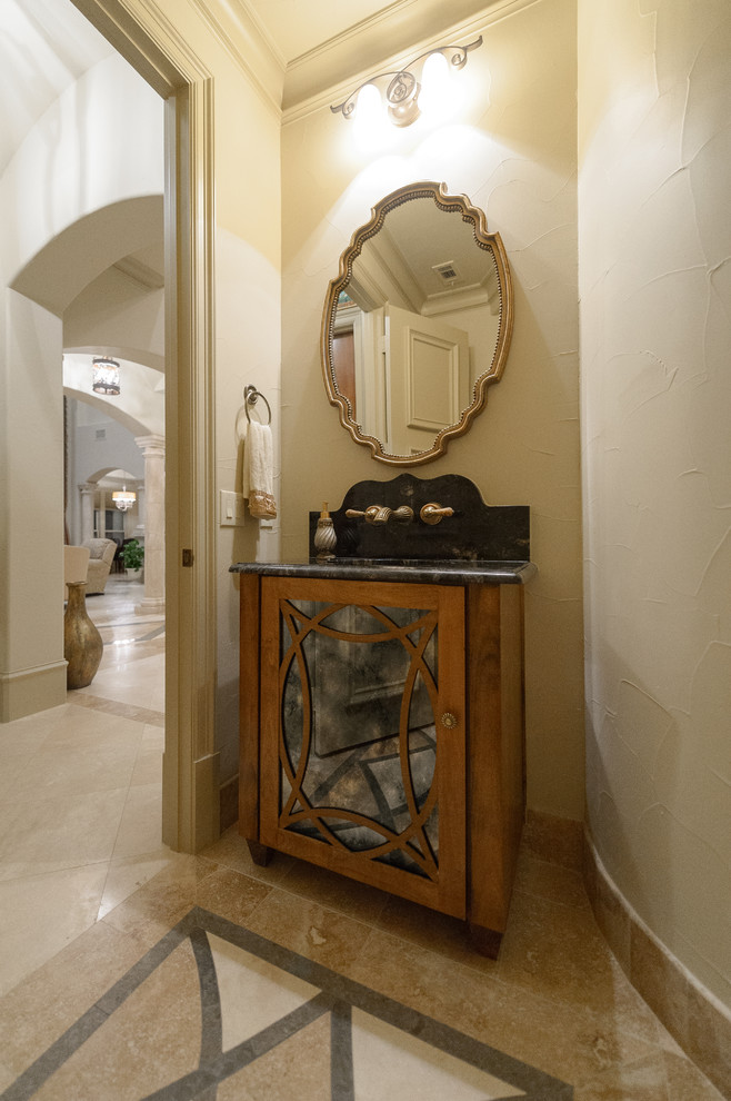Example of a tuscan powder room design in Dallas