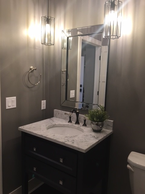Design ideas for a classic cloakroom in Milwaukee with brown cabinets, a one-piece toilet, grey walls, a pedestal sink, granite worktops and grey floors.