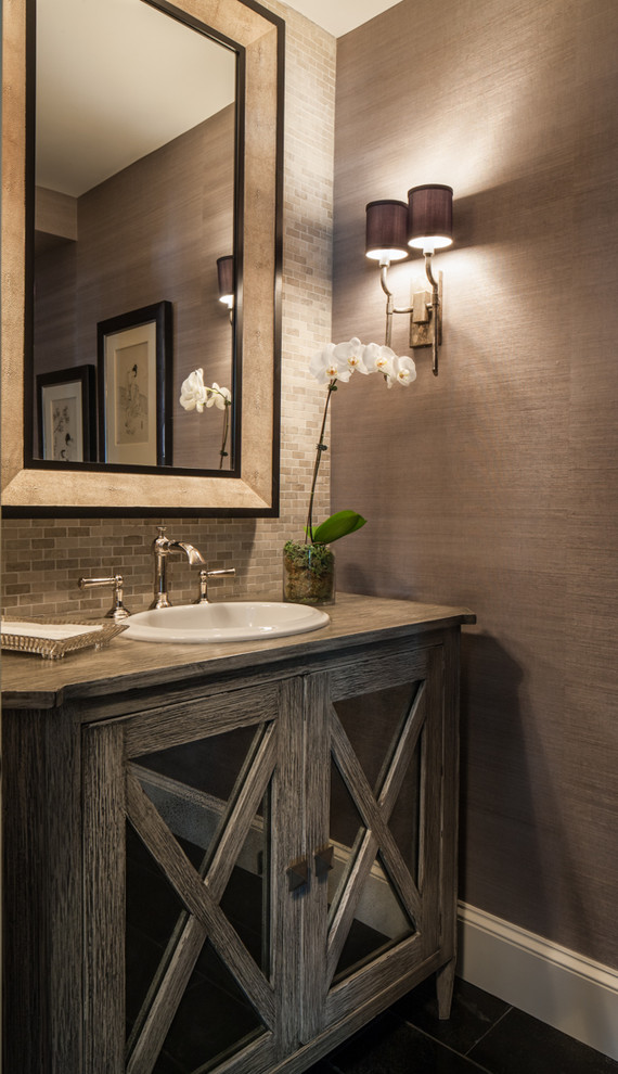 Powder room - mid-sized contemporary gray tile and mosaic tile ceramic tile powder room idea in DC Metro with a drop-in sink, furniture-like cabinets, distressed cabinets, wood countertops, a two-piece toilet, gray walls and gray countertops